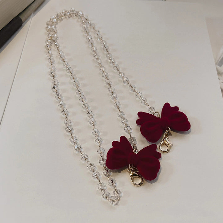 Jewelry holder chain with velvet bow pendant Bowlift