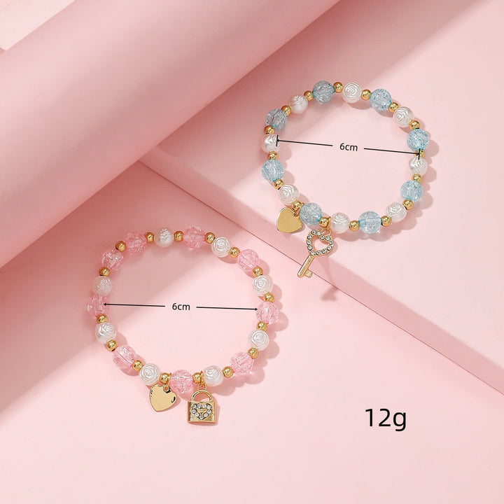Playful bracelet set with heart and key design Bowlift