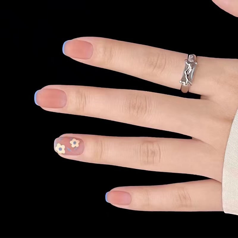 Creative nail design with floral accents Bowlift
