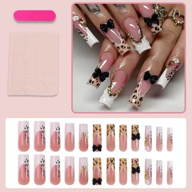 Artistic Press-On Nail Design with Bow and Animal Print Accents Bowlift