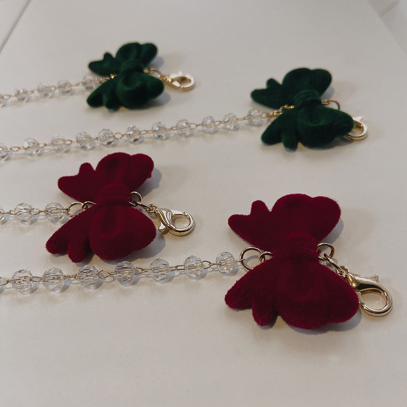 Jewelry holder chain with velvet bow pendant Bowlift
