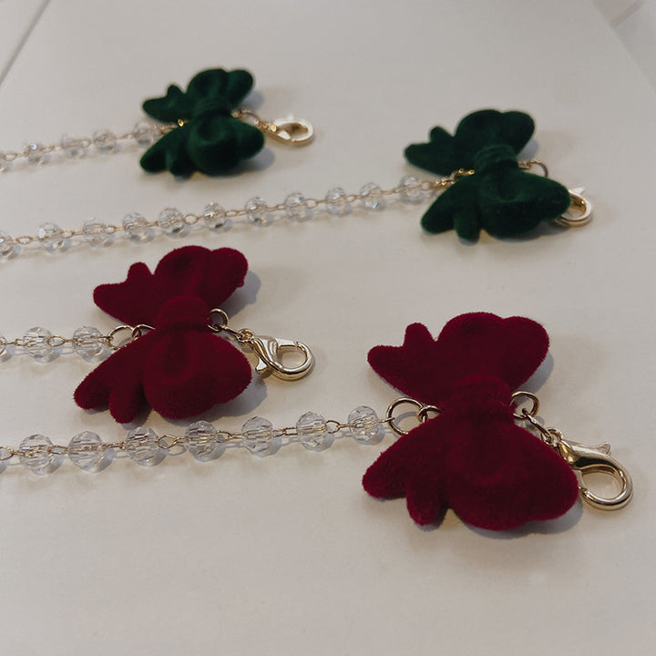 Jewelry holder chain with velvet bow pendant Bowlift