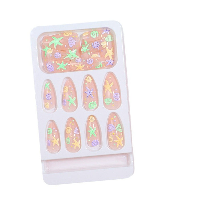 Artistic Press-On Nail Design with Ocean-Inspired Accents Bowlift