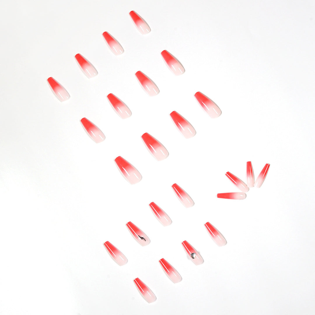 Artful stiletto nails with elegant gradient and rhinestone embellishment Bowlift