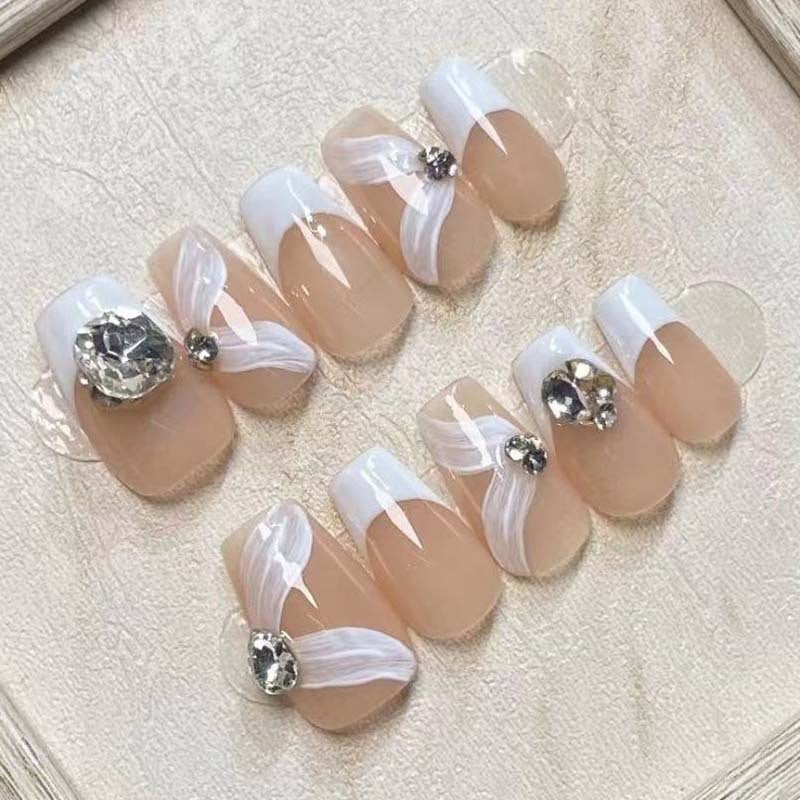 Elegant artificial nail set with delicate decorations and glitter elements Bowlift
