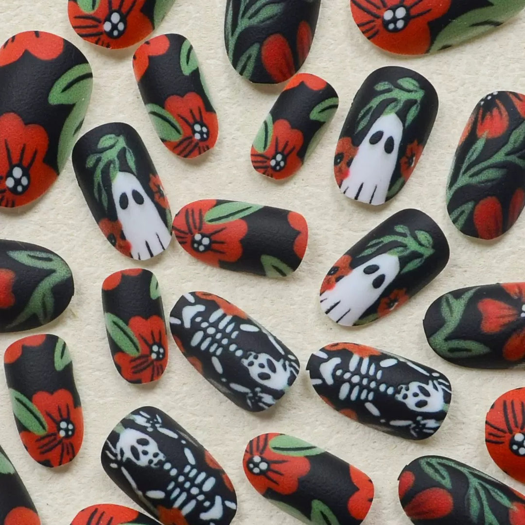 Acrylic nail set with creepy Halloween designs and floral accents Bowlift