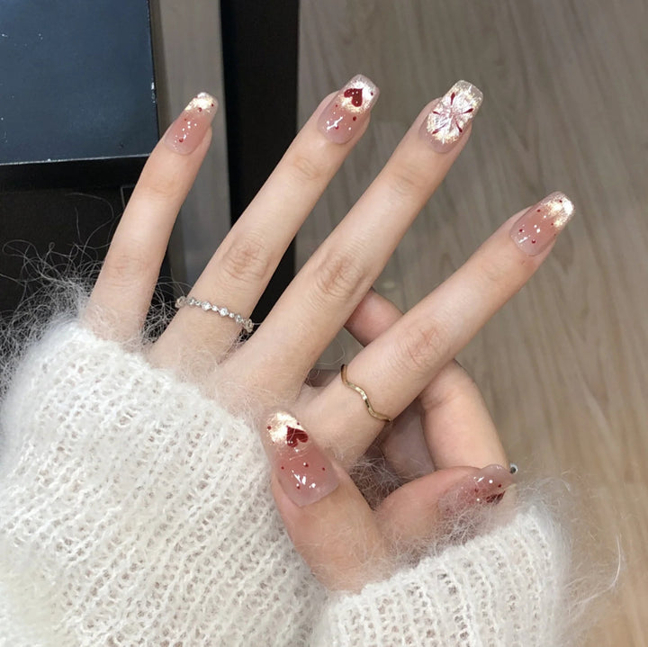Artistic Press-On Nail Set with Heart and Design Accents Bowlift