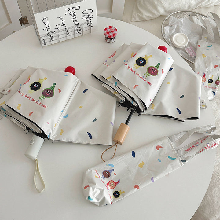 Women Folding Umbrella with Playful Cartoon Designs Bowlift