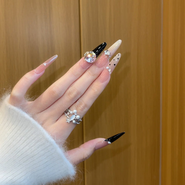 Elegant artificial nails with rhinestone and glitter elements Bowlift