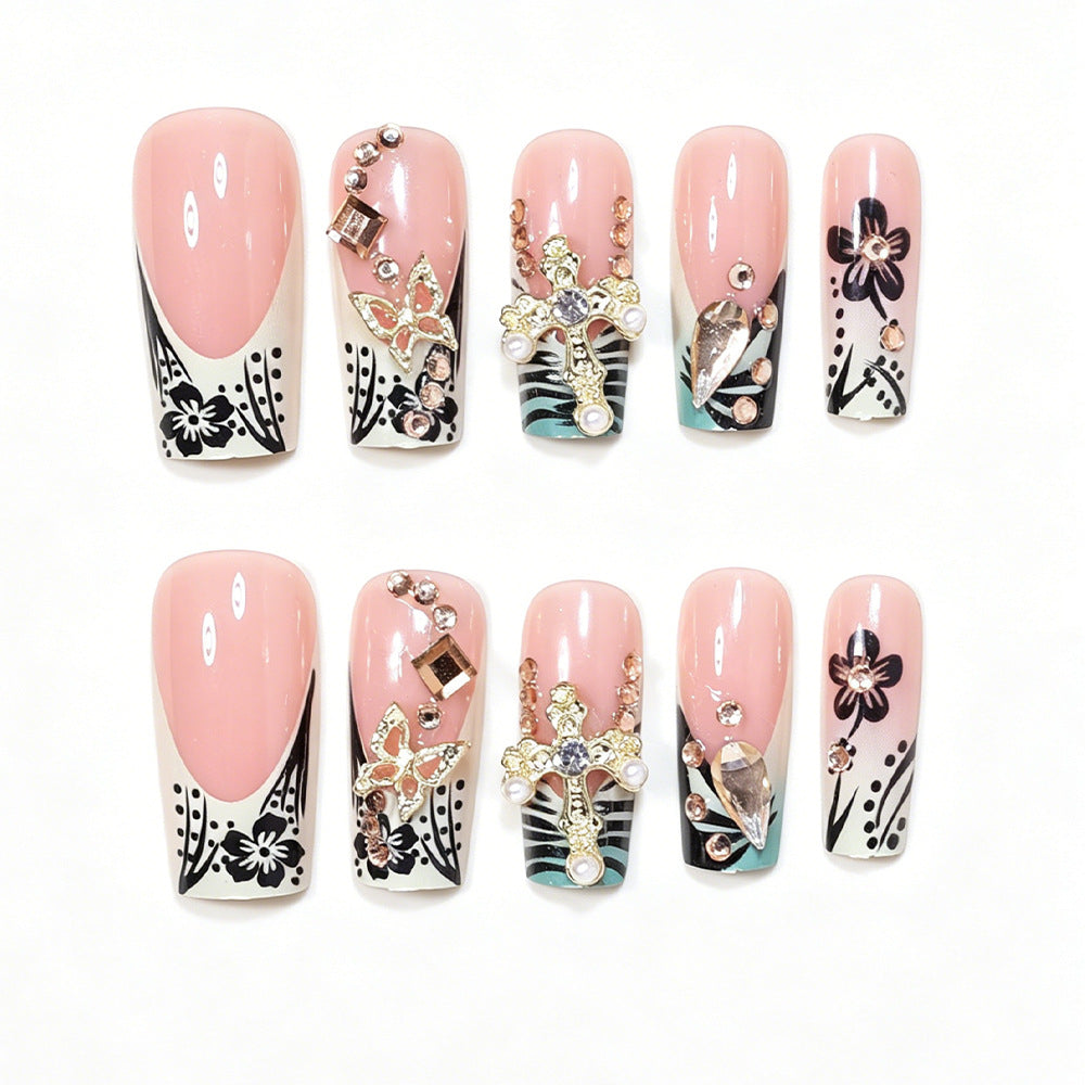 Artistic Stiletto Nail Design with Floral Accents and Gems Bowlift