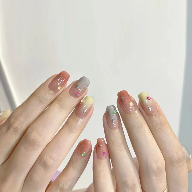 Artificial nails with heart design and glamorous accents Bowlift