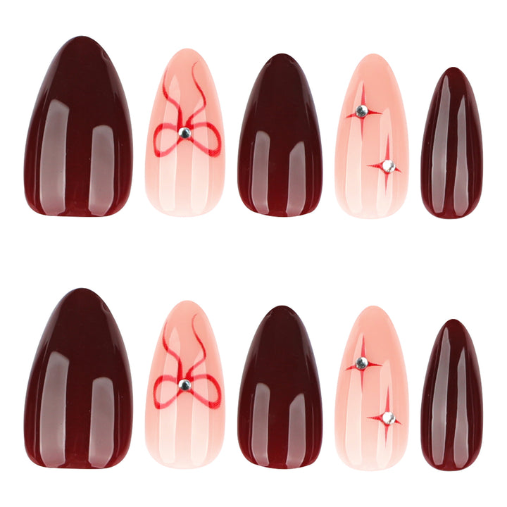 Artful nail art with elegant bows and rhinestone embellishments Bowlift