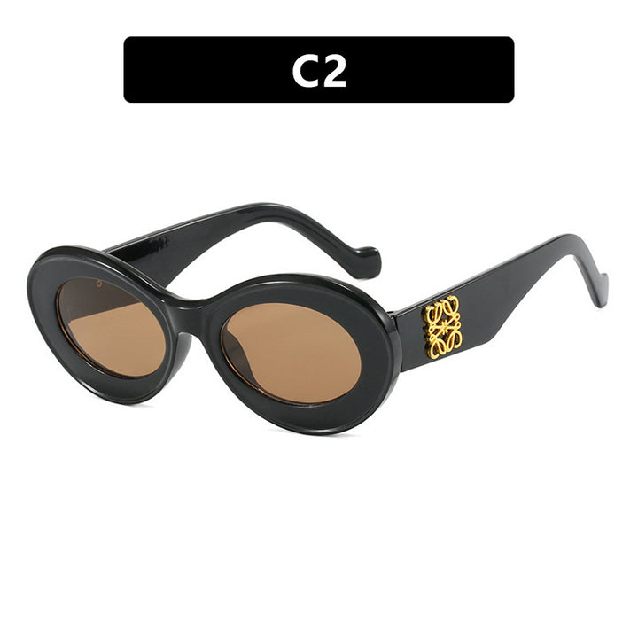 Women's fashionable sunglasses with oval frame and golden accents Bowlift