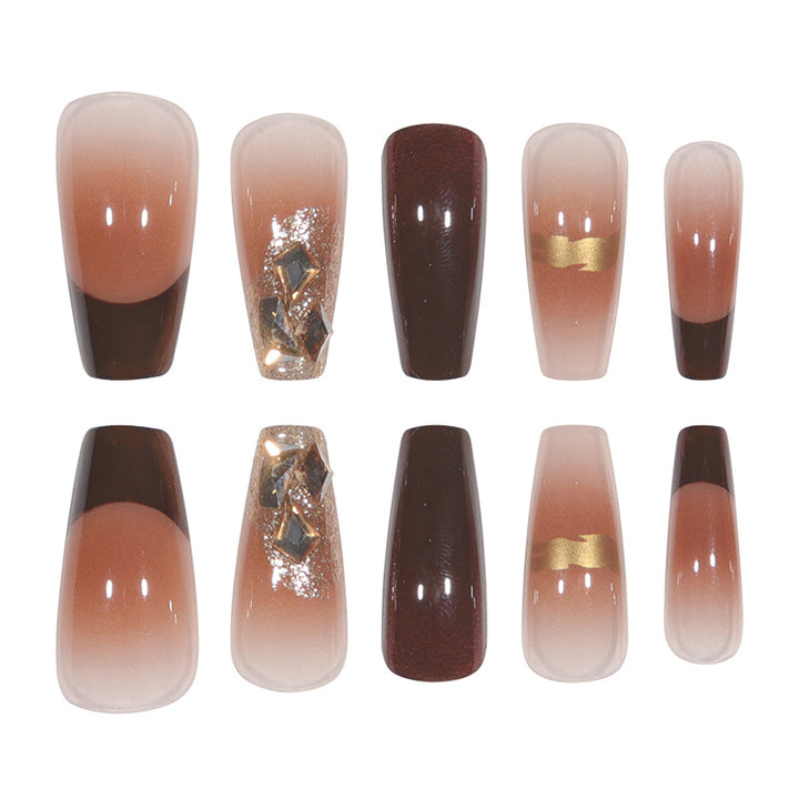 Elegant Long Press-On Nails with Decorative Gold Accents Bowlift