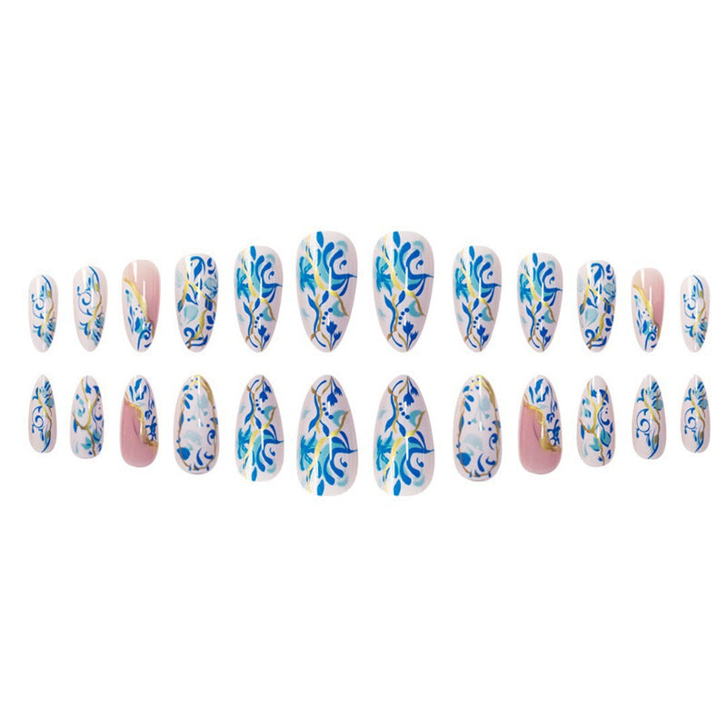 Artistic Floral Press-On Nail Design with Gold Accents Bowlift