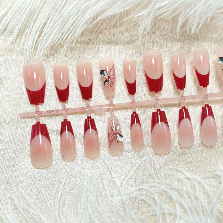Artificial nails with elegant floral design and glitter accents Bowlift