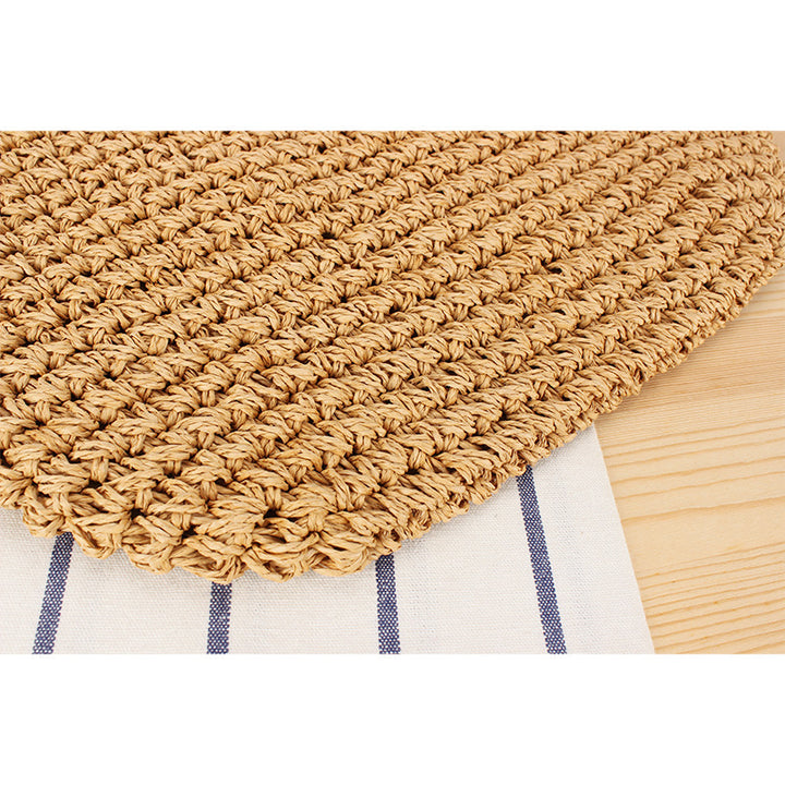 Beach bag made of natural raffia with playful design and elegant bow decoration Bowlift