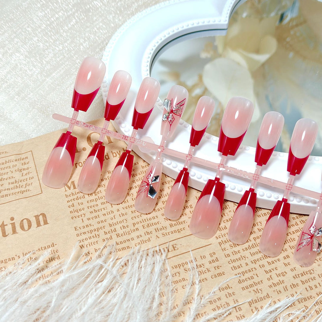 Artificial nails with elegant floral design and glitter accents Bowlift