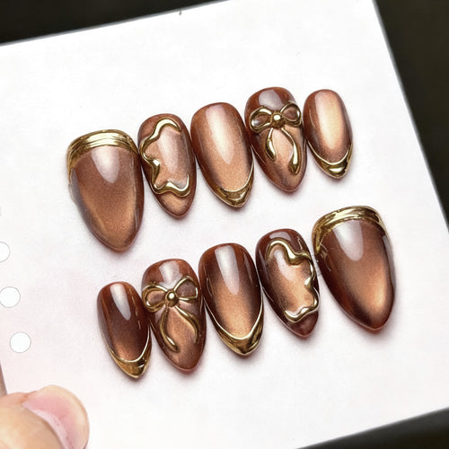 Elegant artificial nails with gold accents Bowlift