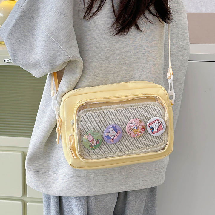 Shoulder bag with transparent viewing pocket and playful graphic design Bowlift