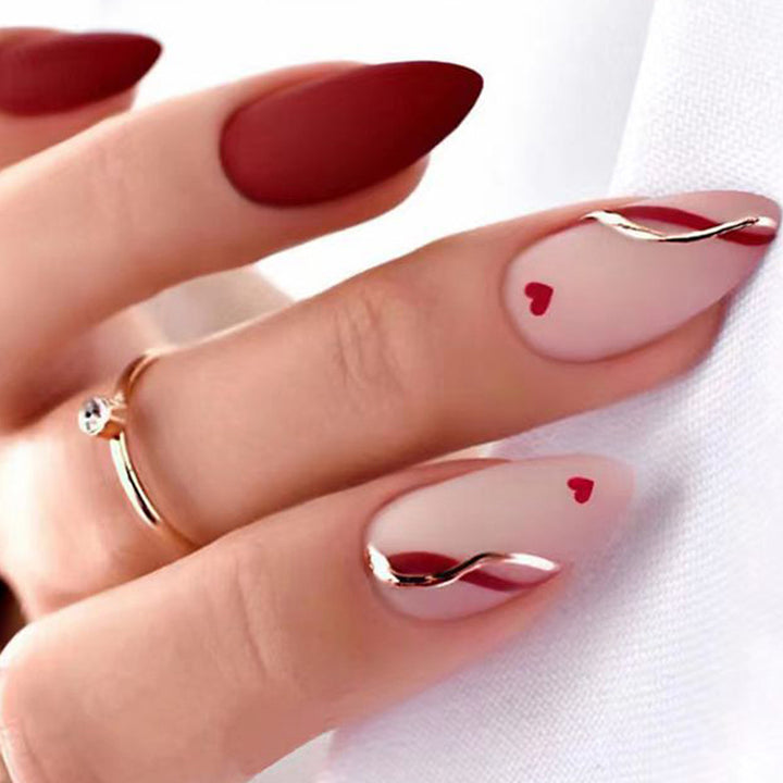 Artful and elegant artificial nails with heart decorations Bowlift