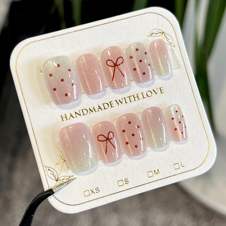 Artificial nail art with cute bow design Bowlift