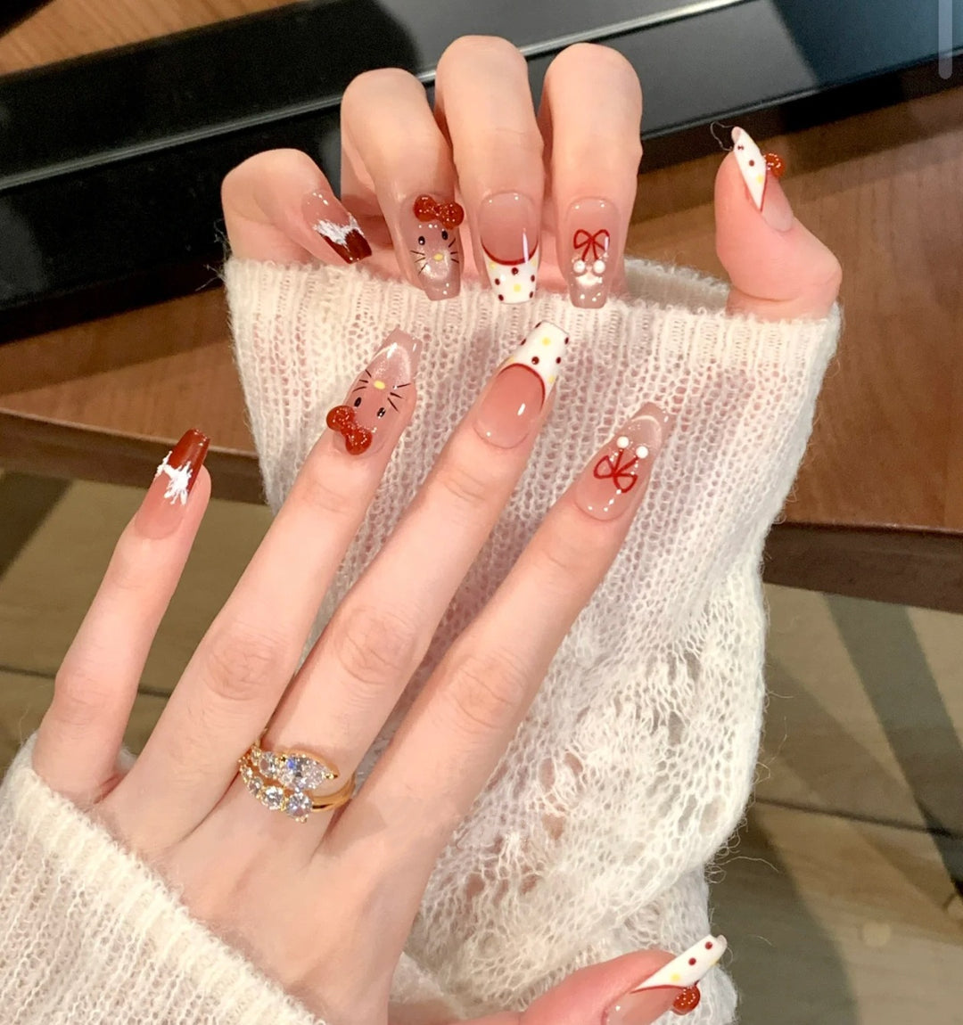 Artistic Press-On Nail Set with Whimsical Holiday Designs Bowlift
