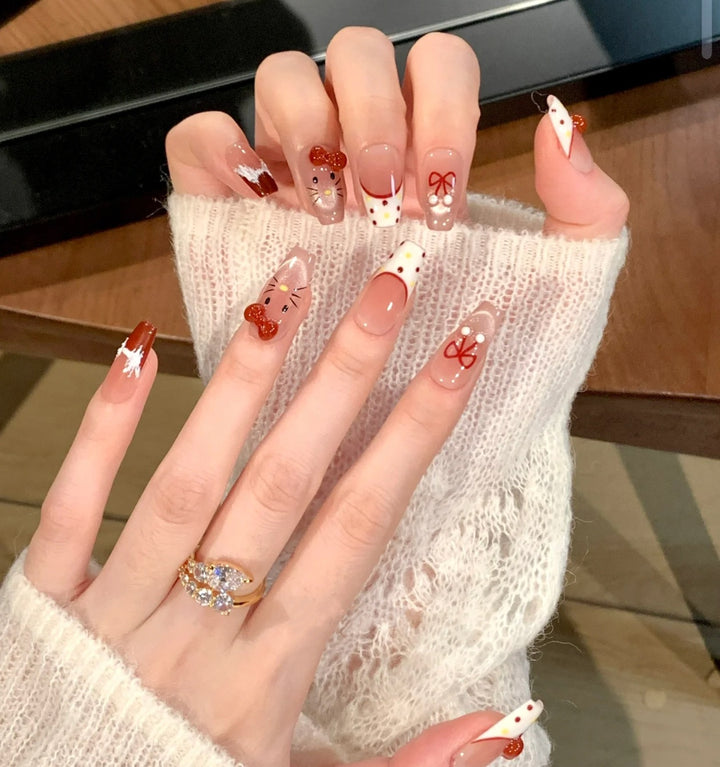 Artistic Press-On Nail Set with Whimsical Holiday Designs Bowlift