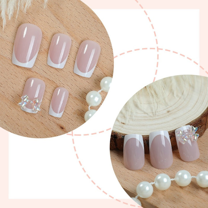Elegant artificial nails with delicate glitter and decorative accents Bowlift
