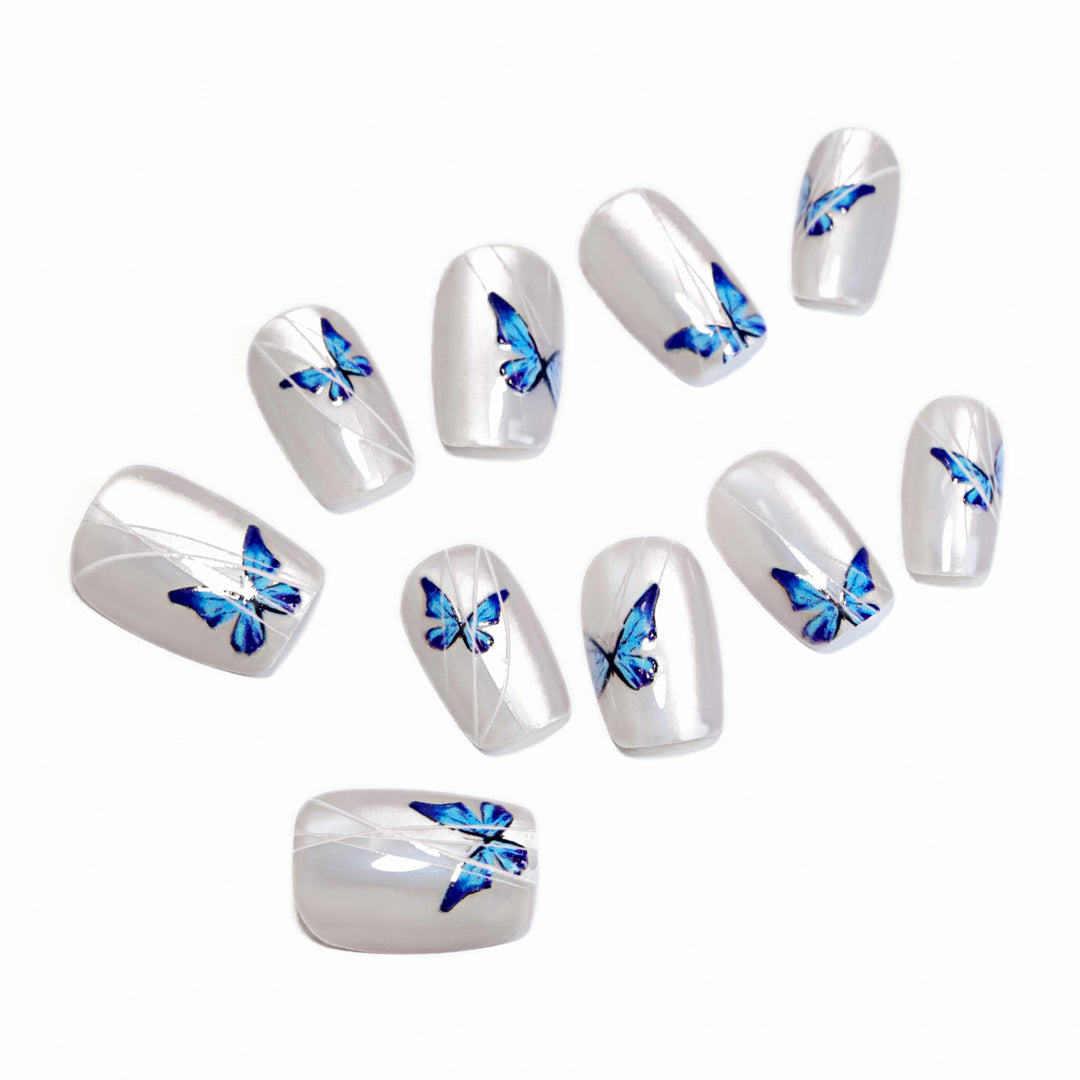 Creative nail extensions with intricate butterfly design Bowlift