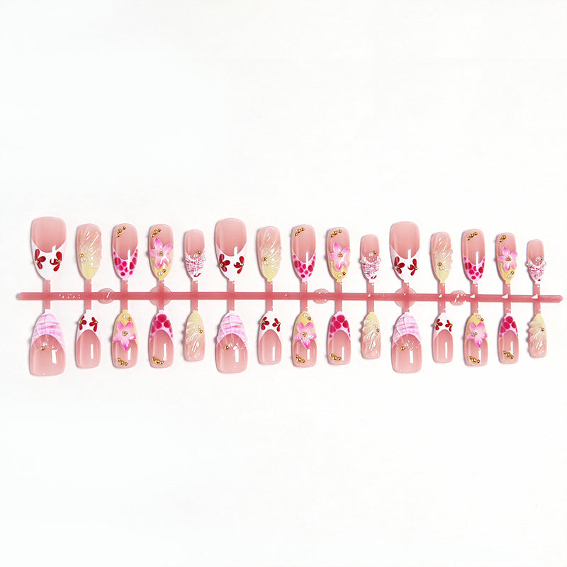 Artificial nails with floral accents and glitter decorations Bowlift