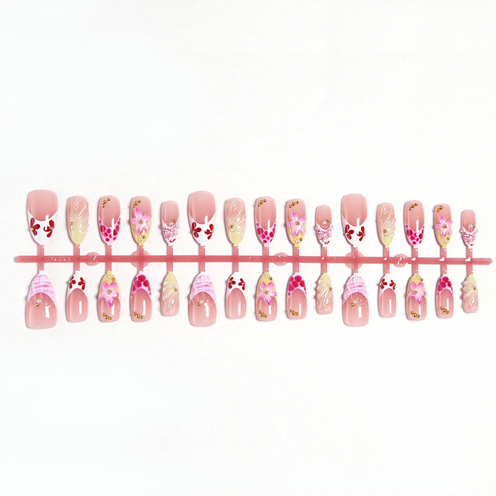 Artificial nails with floral accents and glitter decorations Bowlift