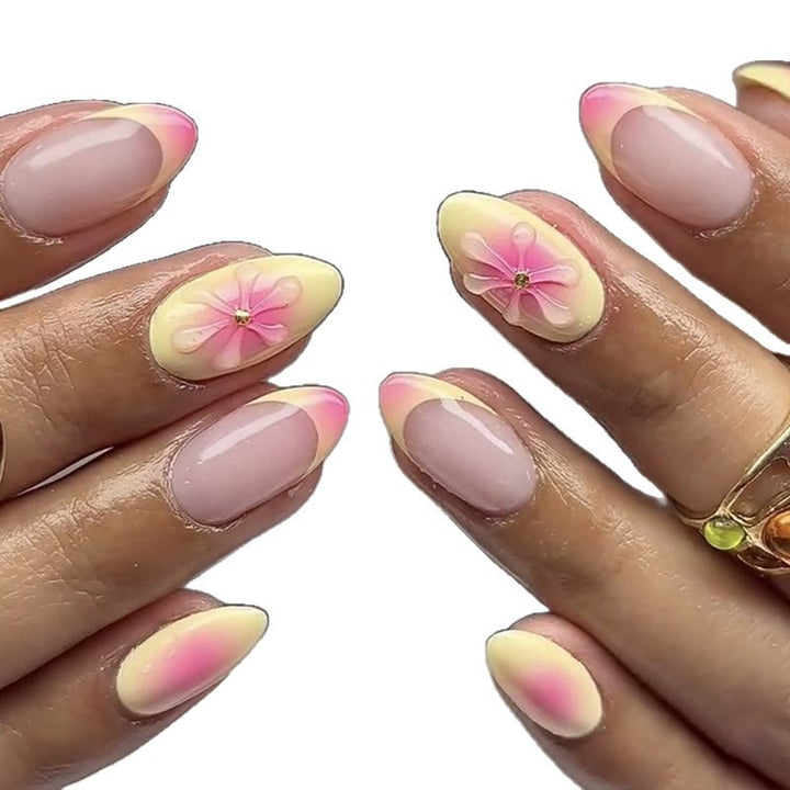 Artistic Almond-Shaped Press-On Nails with Floral Accents Bowlift