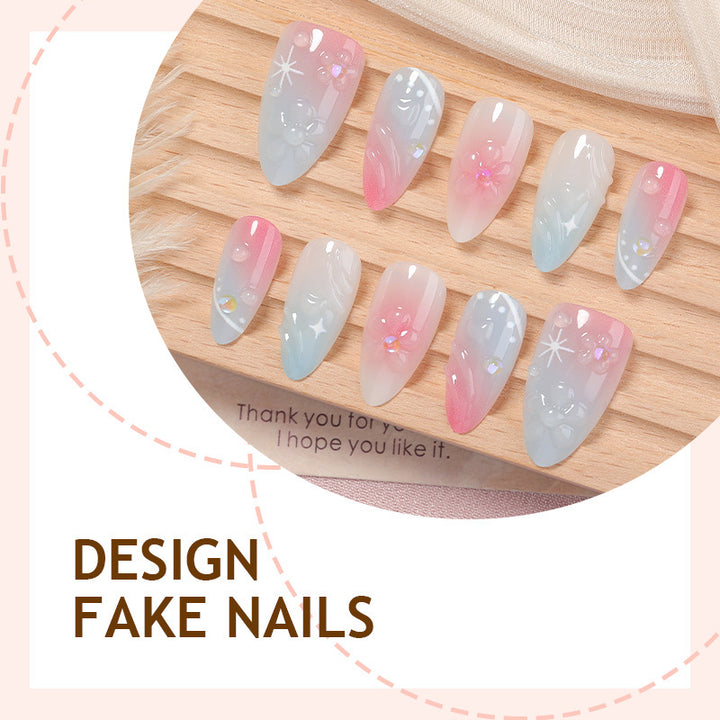 Acrylic nail set with elegant ombre design and floral decorations Bowlift