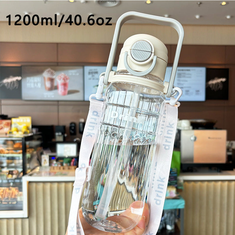 Women's large transparent drinking bottle with integrated carrying handle Bowlift