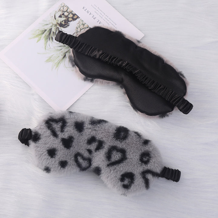 Women's cuddly faux fur sleep mask with heart-embossed surface and gathered comfort band Bowlift