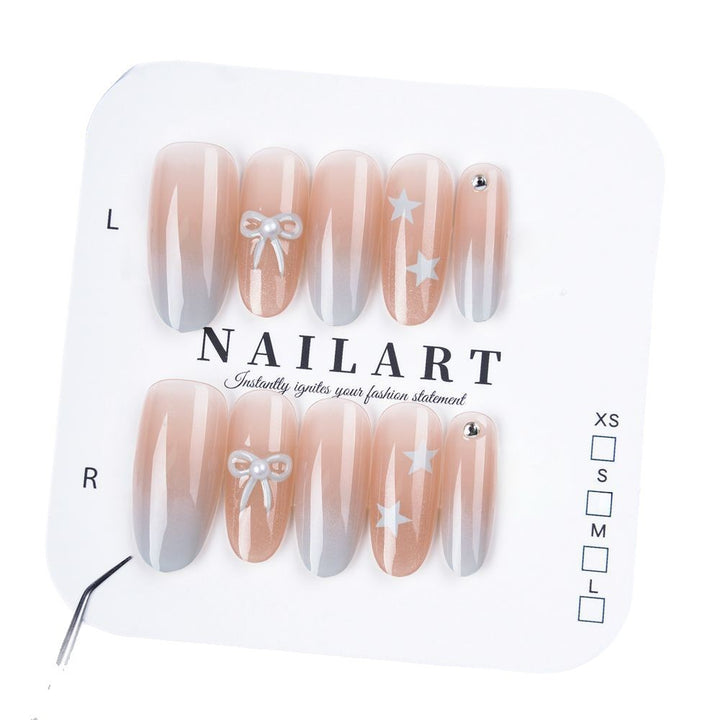 Artificial nails with elegant ombre effect and decorative accents Bowlift