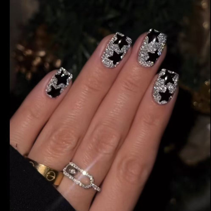Artificial nail set with glamorous rhinestone embellishments and star motifs Bowlift
