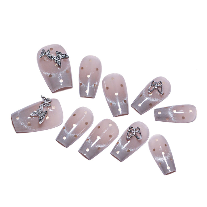 Artificial nail art with glitter details and bow accents Bowlift