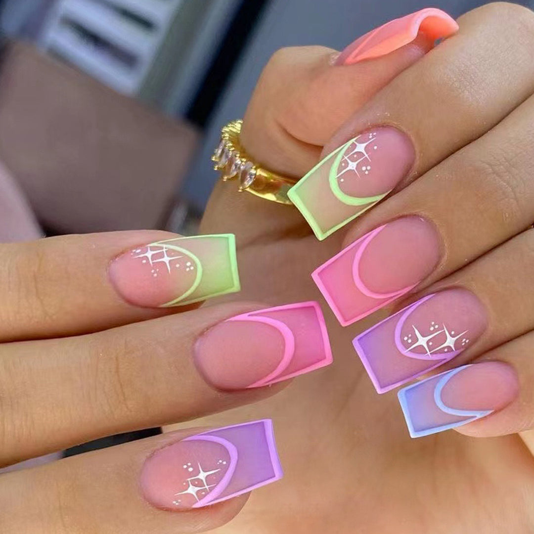 Acrylic nail set with colorful geometric designs and glitter accents Bowlift