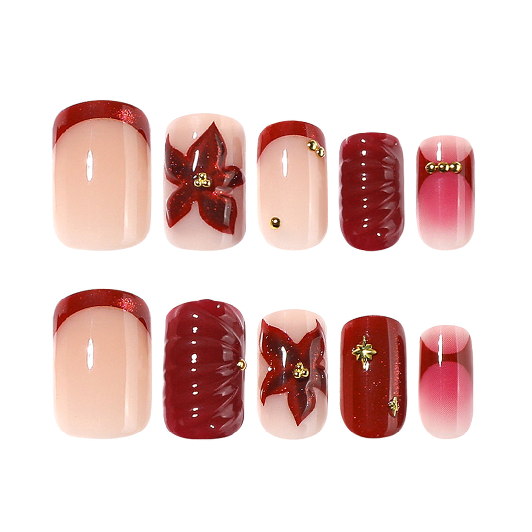 Artful nail design with floral and golden accents Bowlift