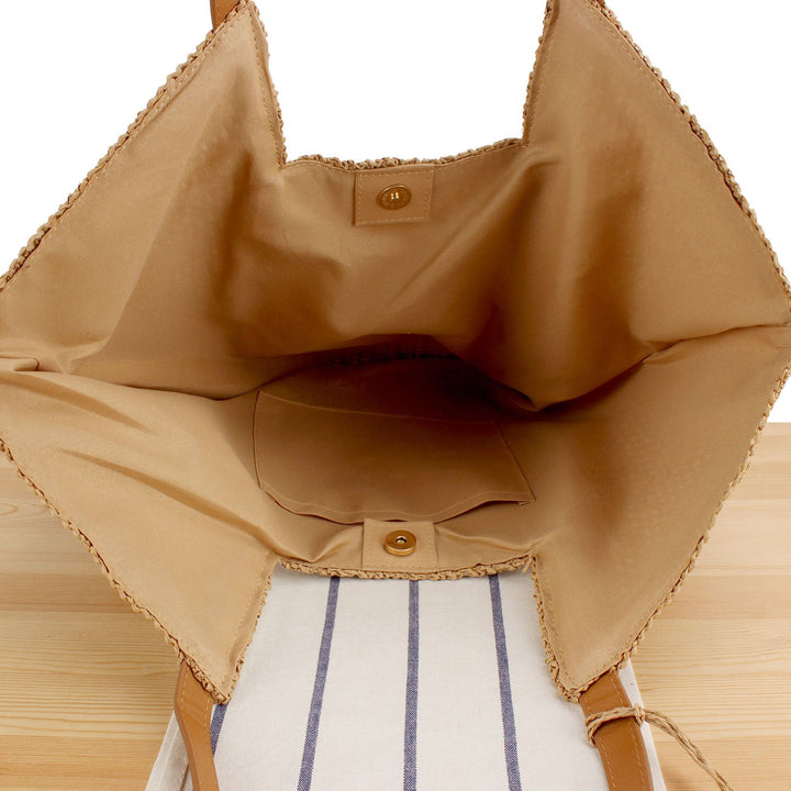 Beach bag made of natural weave with elegant leather accents Bowlift