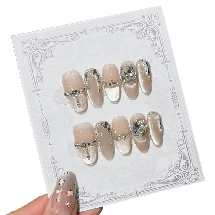 Glamorous nail tips with rhinestone and glitter effects Bowlift