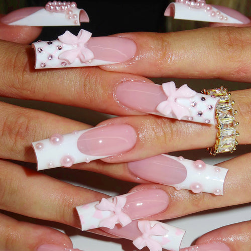 Artistic acrylic nails with bow and pearl decorations Bowlift