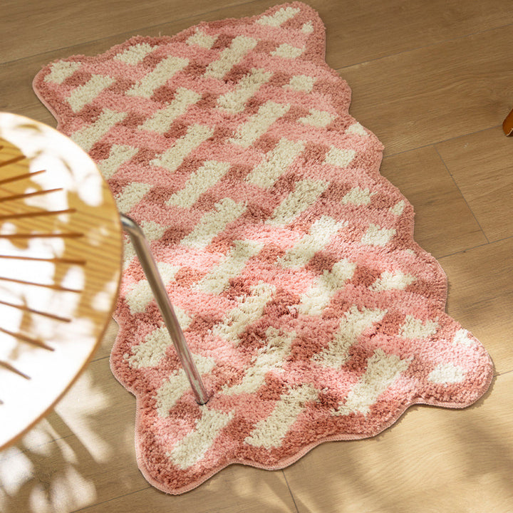 Tufted bathroom runner with wavy hem and relief-style braided pattern Bowlift