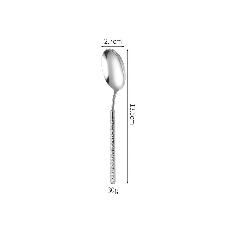 Elegant dessert spoon with elaborate handle design Bowlift