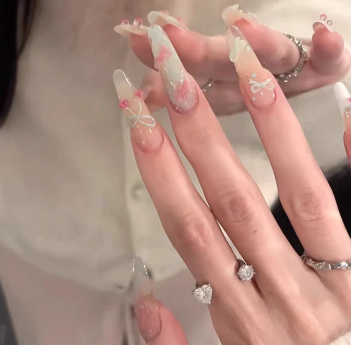 Artistic Press-On Nail Set with Floral and Glossy Accents Bowlift