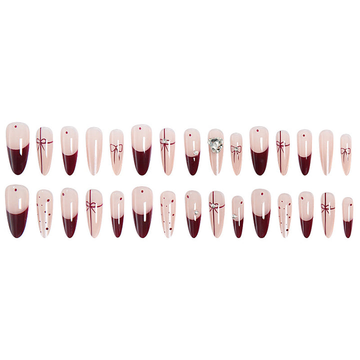 Artificial nail set with elegant bow and glitter details Bowlift