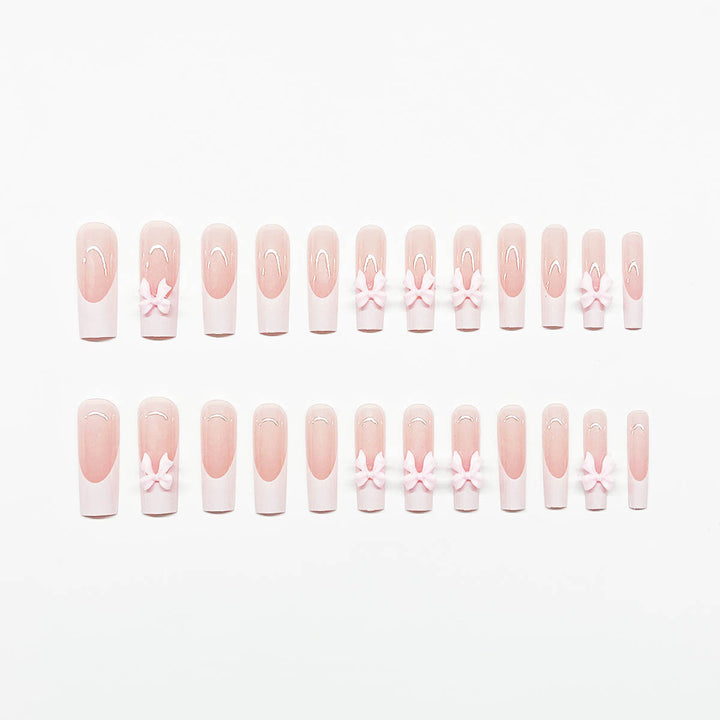 Artificial nails with playful bow design Bowlift