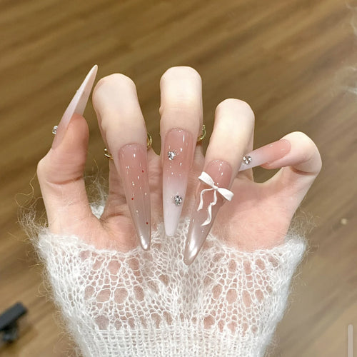 Artificial nails with elegant ombre design and delicate accents Bowlift